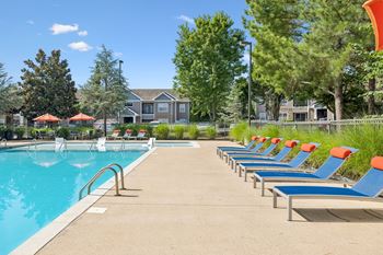 Outdoor pool with tanning shelf